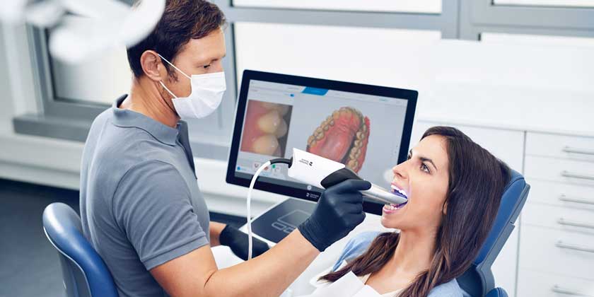 Dentist using Primescan digital scanner at Great Teeth